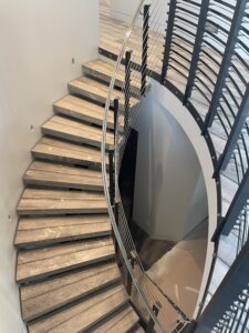 Floating curved hardwood stair design