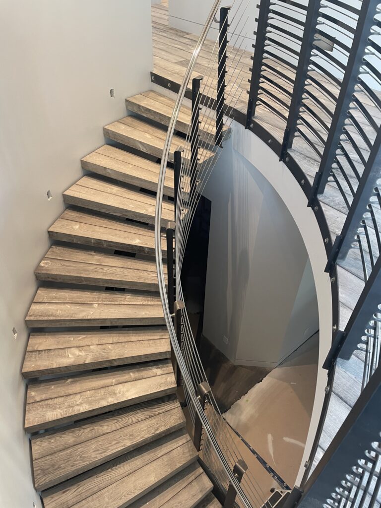 Floating curved hardwood stair design