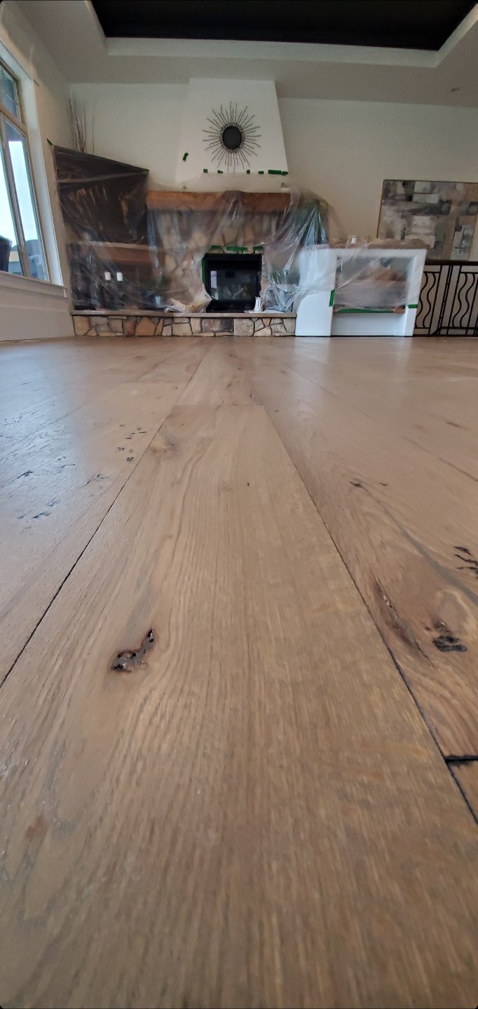 Hardwood floor after full refinish with restored gleaming finish