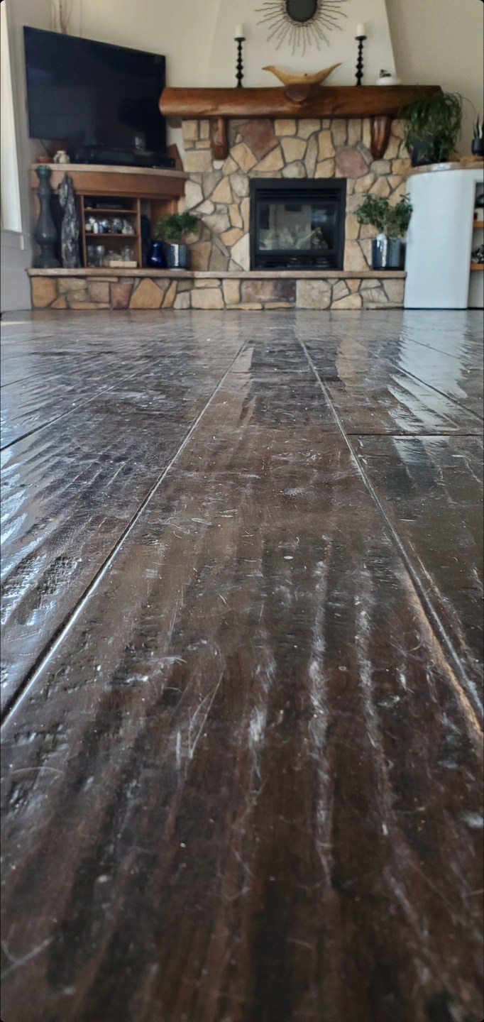 Hardwood floor before refinish showing dull worn finish