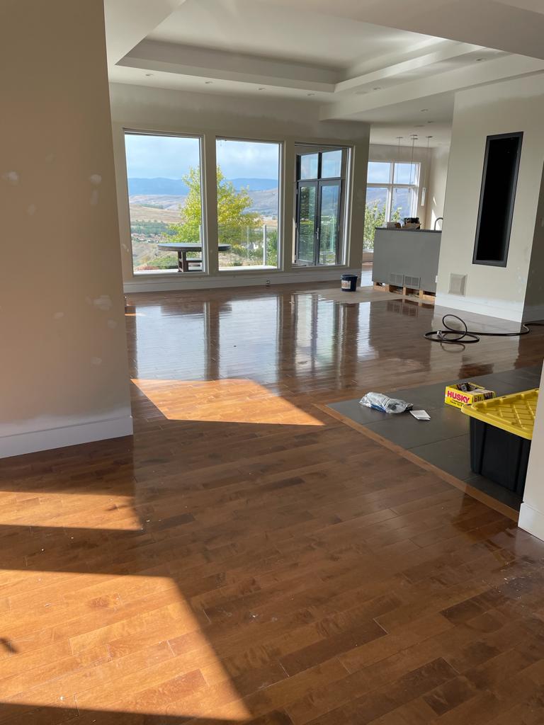 Worn hardwood floor before refinish showing finish breakdown